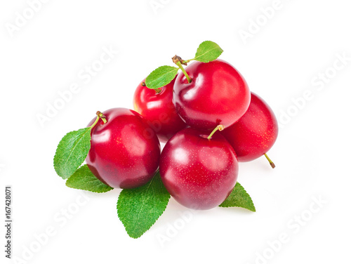 Group of sweet ripe red plums with leaves, isolated on white background