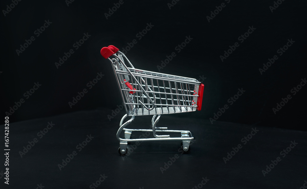 Shopping cart or trolley  on black background