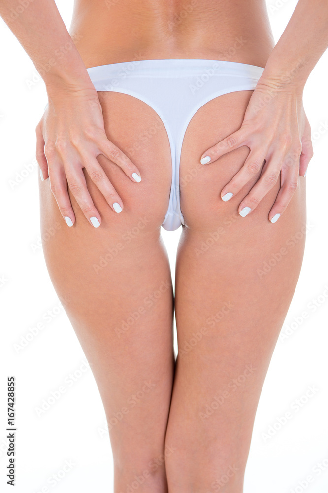 Slim sexy woman touching her butt. On white background Stock Photo | Adobe  Stock
