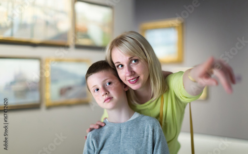 Mom and son exploring paintings