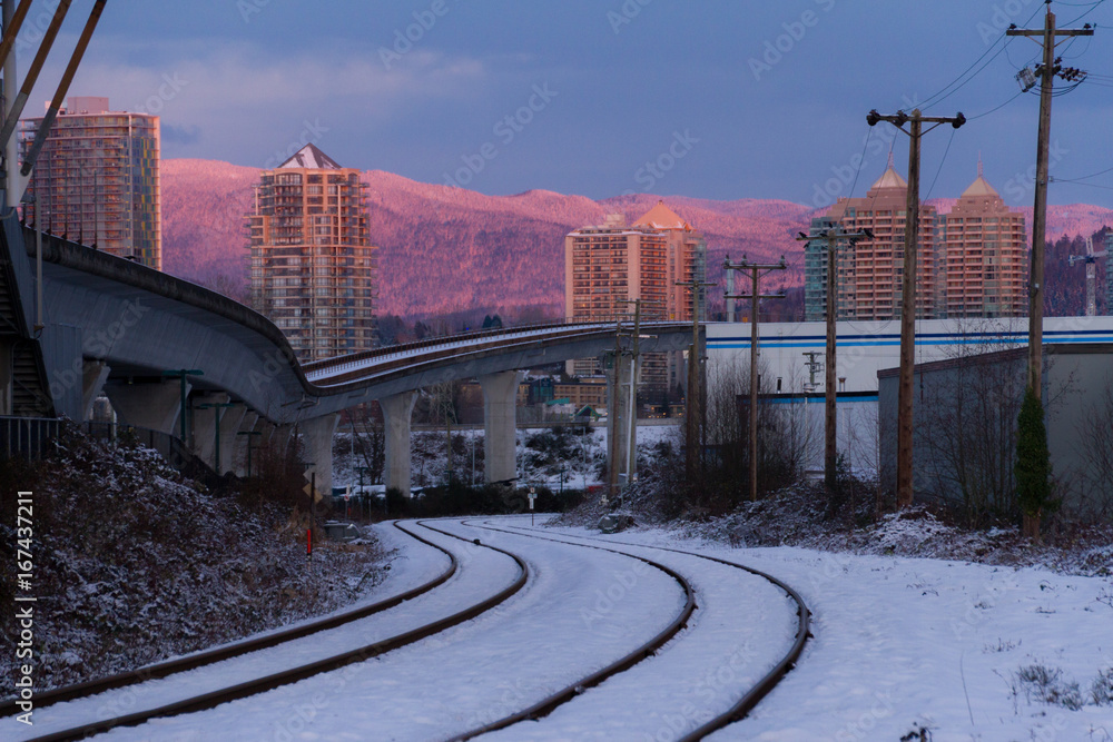 Empty rail in city while colorful sunset in winter