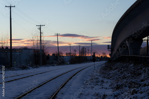 Empty rail in city while colorful sunset in winter © Martin Hossa