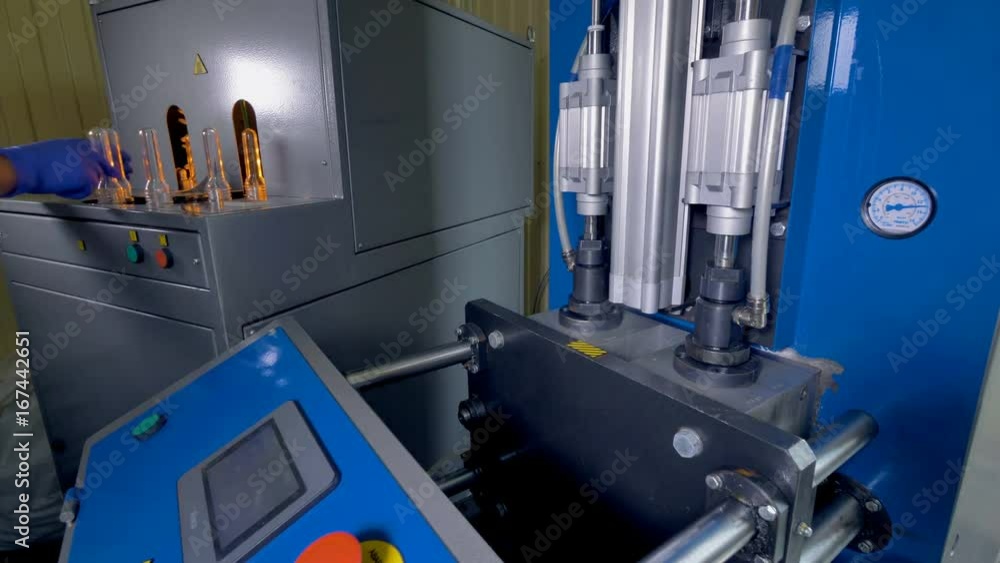 Plastic bottles production. Working blow-molding machine. Plastic bottles production. Working blow-molding machine.