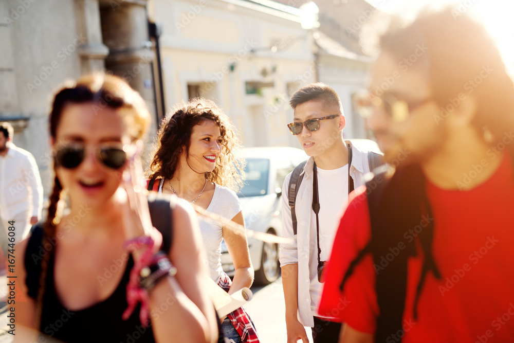 Group of beautiful tourists are enjoying summer in the city. Group of beautiful tourists are enjoying summer in the city.