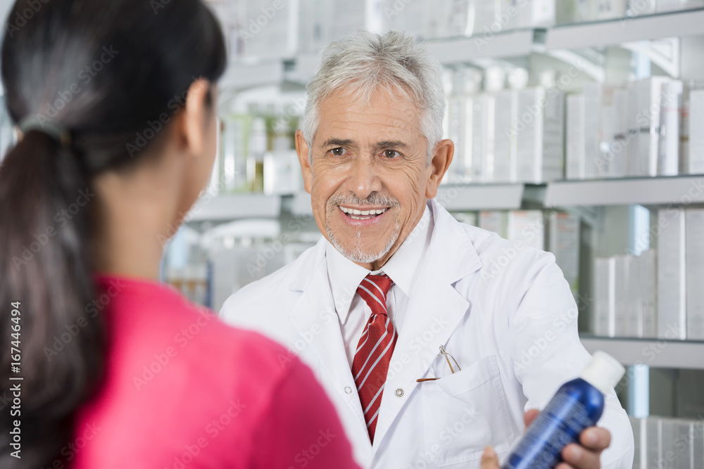 Pharmacist Selling Deodorant To Woman Pharmacist Selling Deodorant To Woman