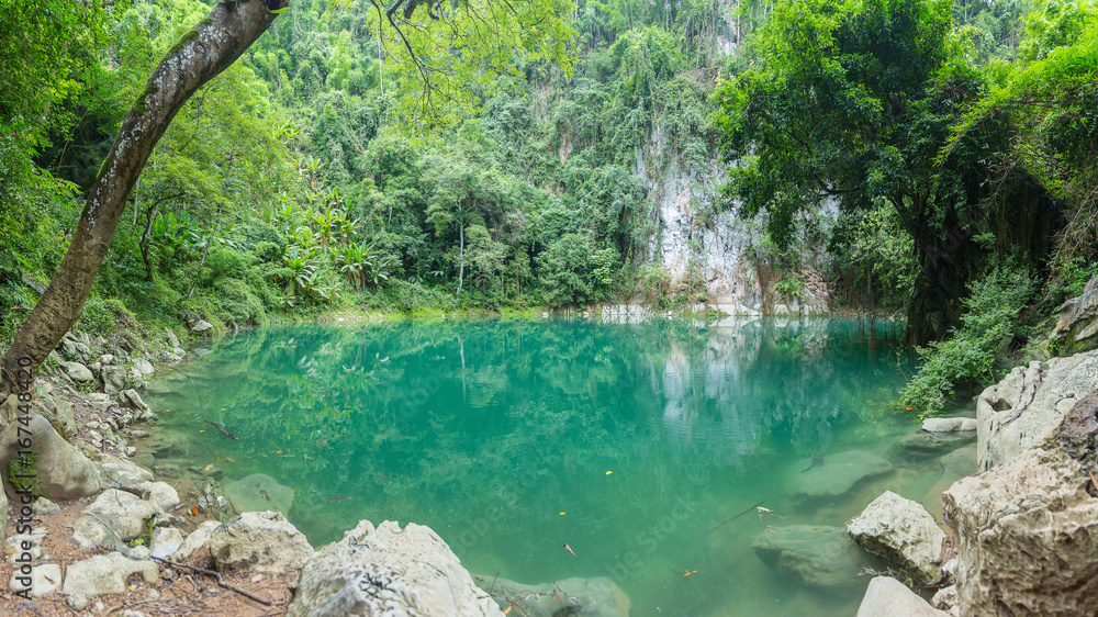 Naklejka premium Lom Phu Kiew is an emerald pool. The mystical beauty of Lampang. Unseen Thailand