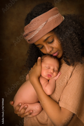 African Mother hugging newborn baby