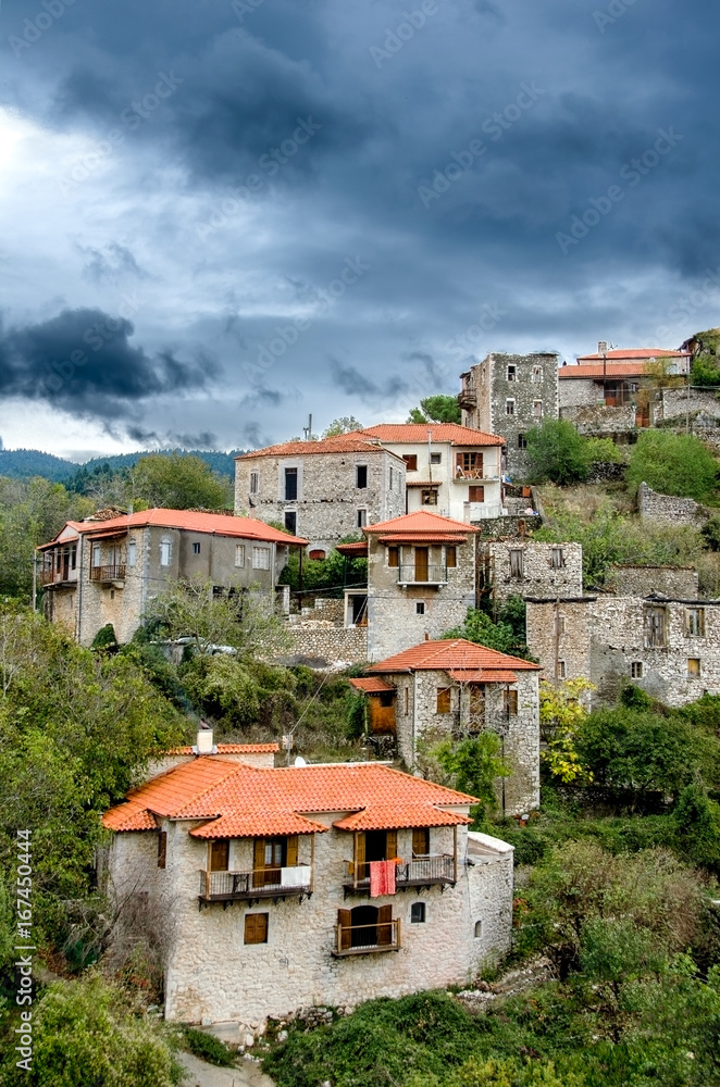 Traditional stone made houses in Stemnitsa village under a dramatic sky.Greece