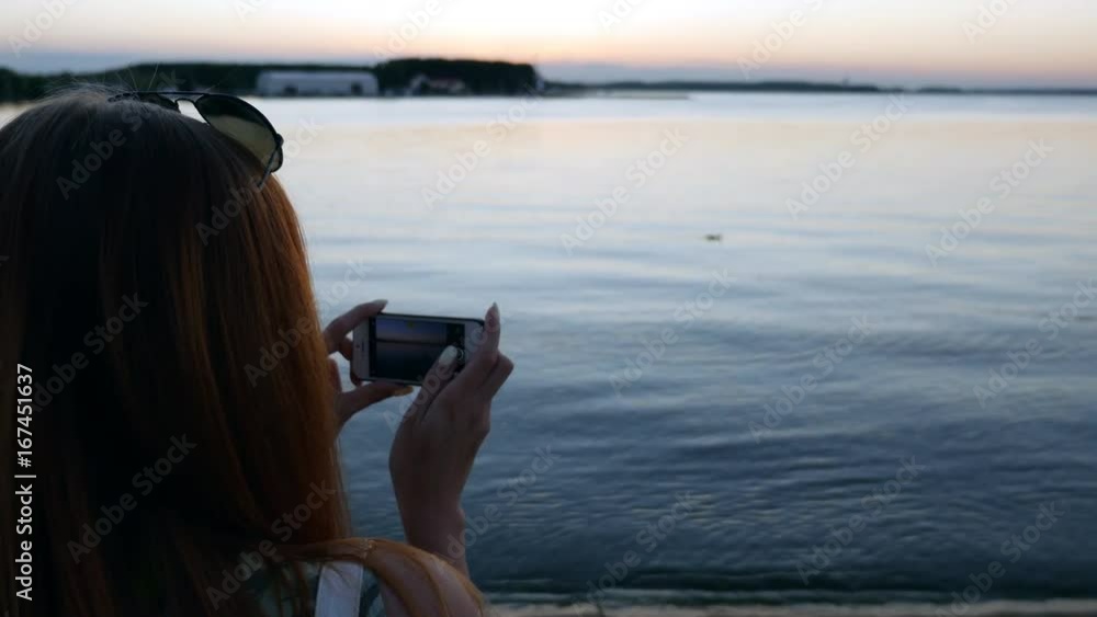 Girl shoots videos about floating ducks. Girl shoots videos about floating ducks.