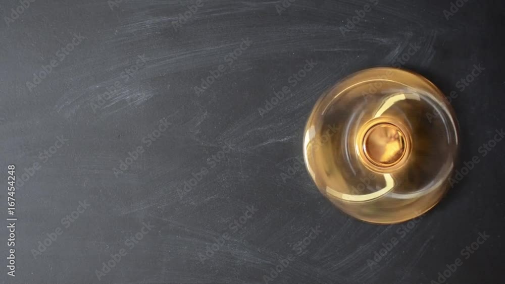 fidget spinner rotate on a black board from above, engine rotate top view with copy space fidget spinner rotate on a black board from above, engine rotate top view with copy space