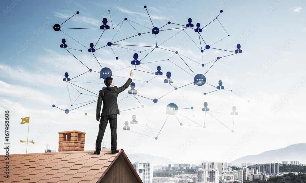 Businessman on house roof presenting networking and connection c