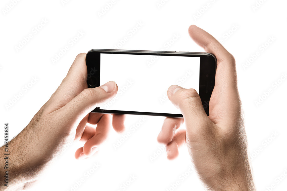 Hand holding Black Smartphone with blank screen on white background Hand holding Black Smartphone with blank screen on white background