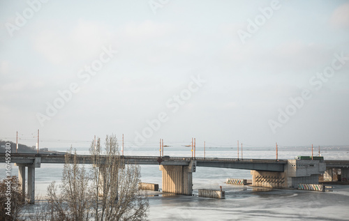 a bridge with passing cars on it © alexxndr
