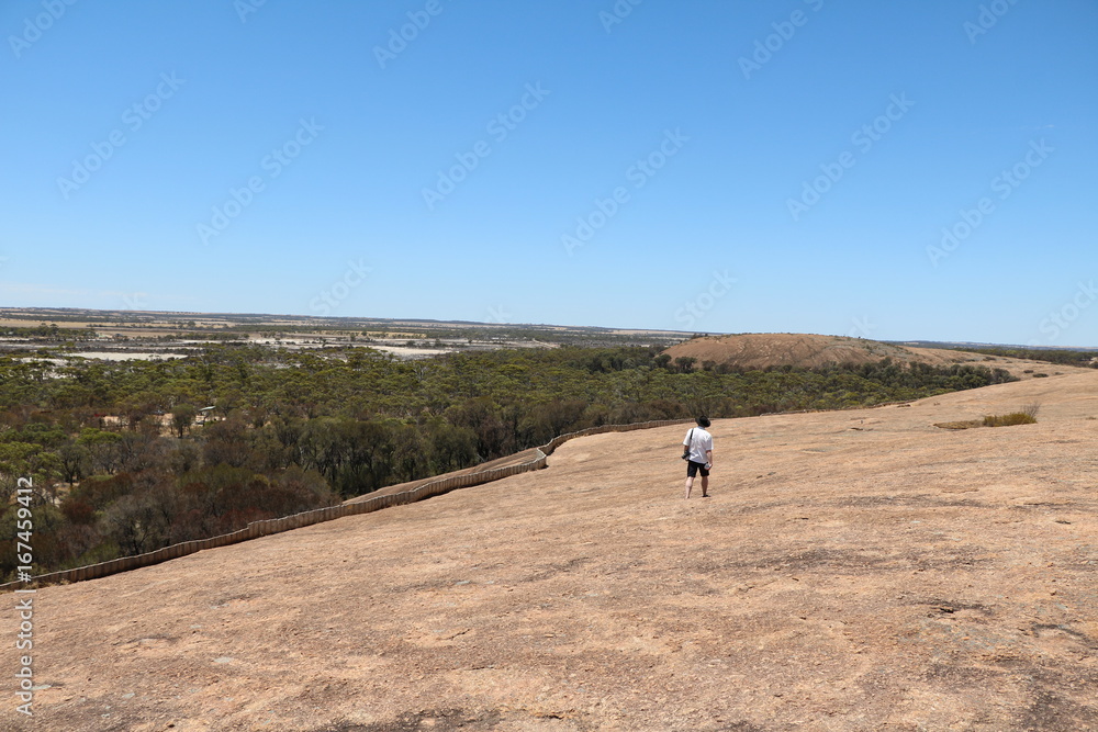 Walking on the Wave Rock in Australia, Hyden Western Australia Walking on the Wave Rock in Australia, Hyden Western Australia