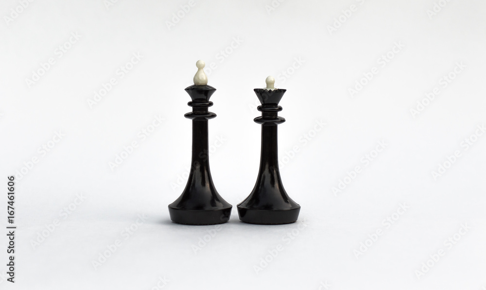 Chess pieces. The black king and Queen on white background. Chess pieces. The black king and Queen on white background.