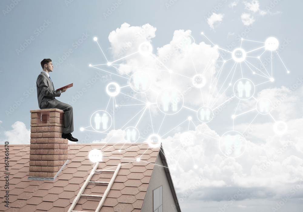 Man on roof reading book and concept of social connection Man on roof reading book and concept of social connection
