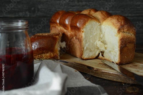 Vászonkép Homemade brioche with jam. Fresh brioche bread.