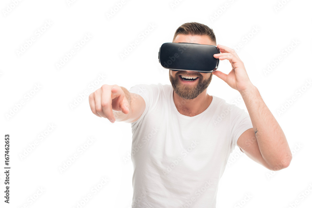 'Portrait of handsome bearded man using virtual reality headset, isolated on white 'Portrait of handsome bearded man using virtual reality headset, isolated on white