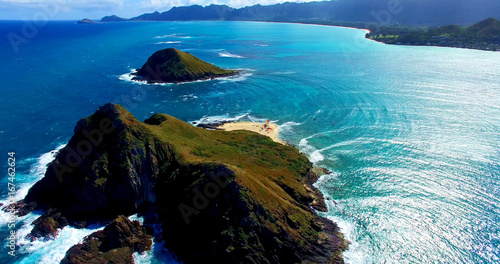 Two Remote Coastal Islands in the Pacific Ocean with a Small Beach Surrounded by Turquoise Blue Ocean Waters - Aerial Shot in Oahu, Hawaii