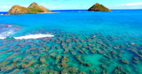 Small Reef in Turquoise Blue Coastal Waters with Two Small Islands - Oahu, Hawaii
