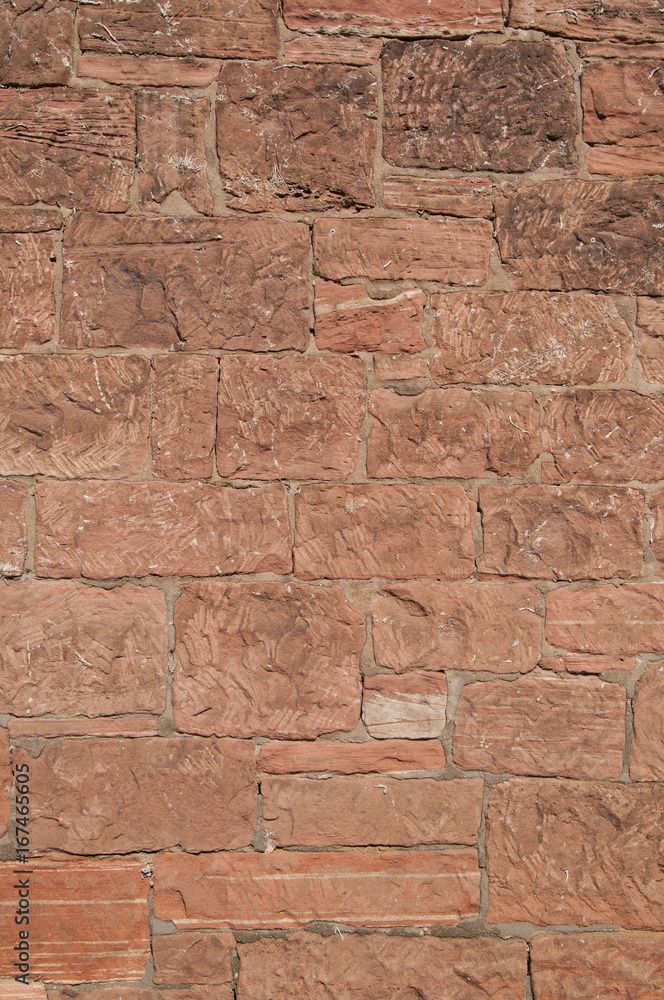Wall mason out of red sandstone Wall mason out of red sandstone