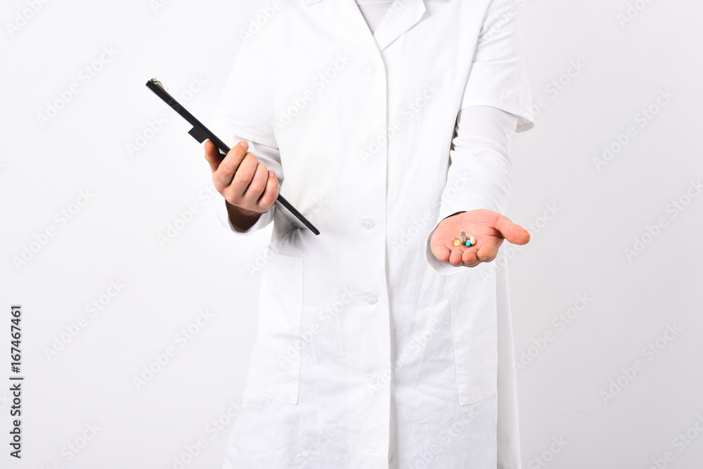 Medical doctors hands hold black folder and drugs Medical doctors hands hold black folder and drugs