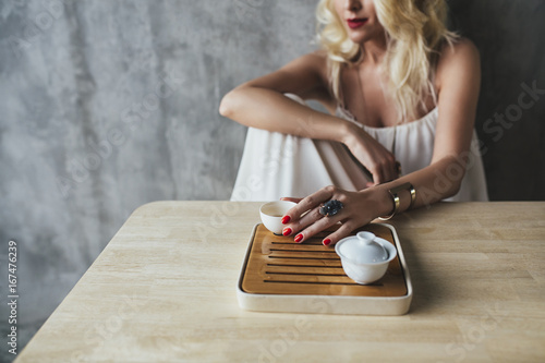 Caucasian Woman Drinks Tea photo