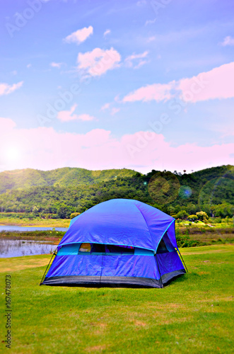 Camping Tent near mountain river in the summer  Sunrise in the morning
