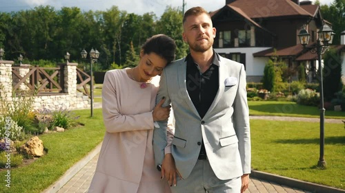 Beautiful couple taking a walk in city park photo