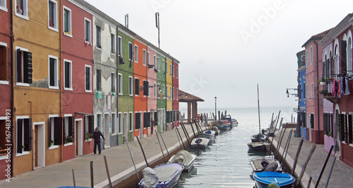 Canal between houses on the island of Burano near Venice, Italy © Lunnaya