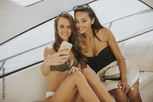 Pretty young women taking s...