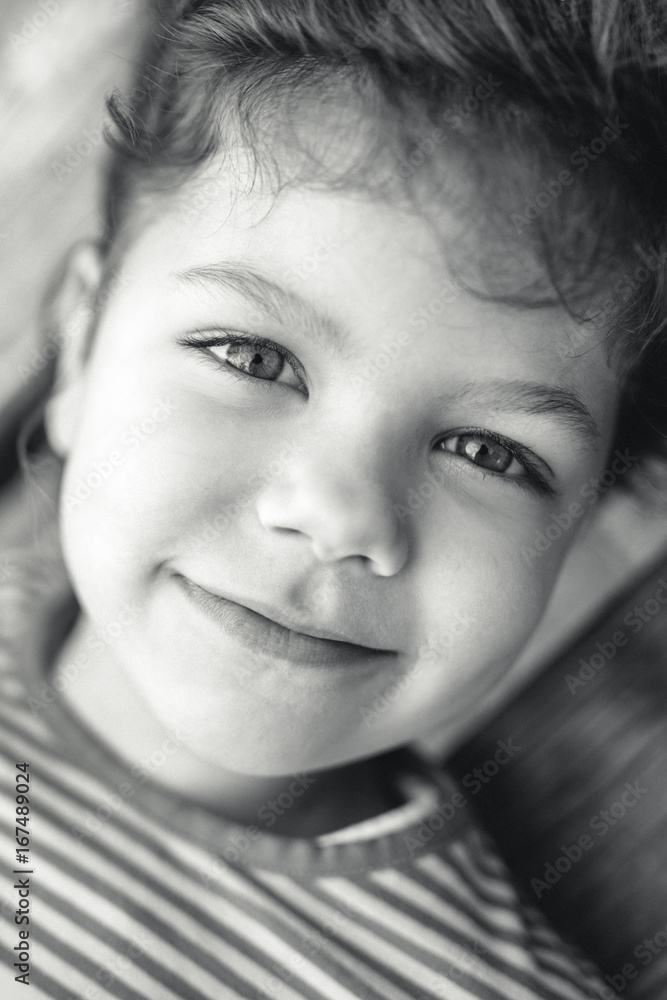 Black and white portrait of a cute smiling young girl Black and white portrait of a cute smiling young girl