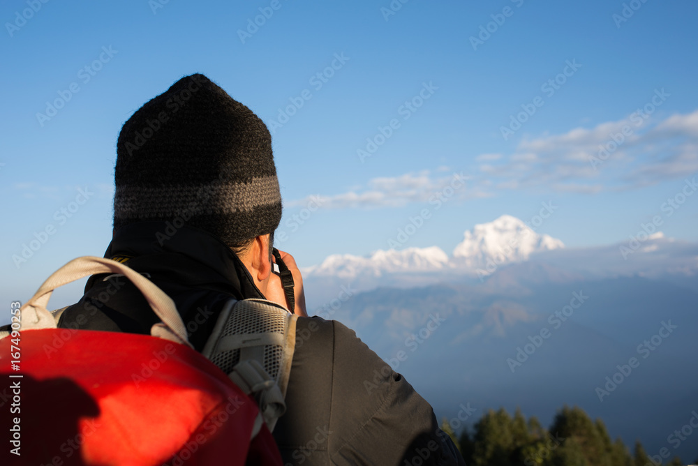 The back of traveler enjoying morning The back of traveler enjoying morning