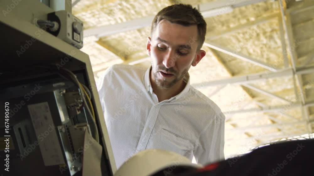 The boss and worker shaking hands after checking a machinery on the work 4K The boss and worker shaking hands after checking a machinery on the work 4K