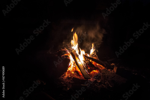 a big campfire in the night. Burning wood on fire