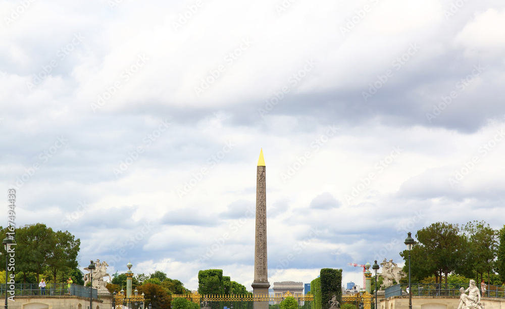 Obelisk of Luxor and arc de triomphe in Paris