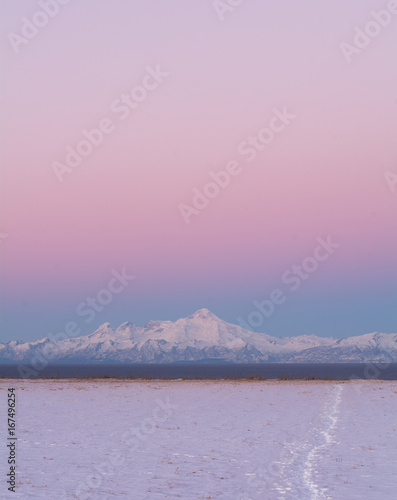 Footprints across snow walking towards Mt Illiama
