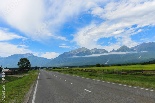  long road to a fabulous beautiful place among the mountains of fields and meadows