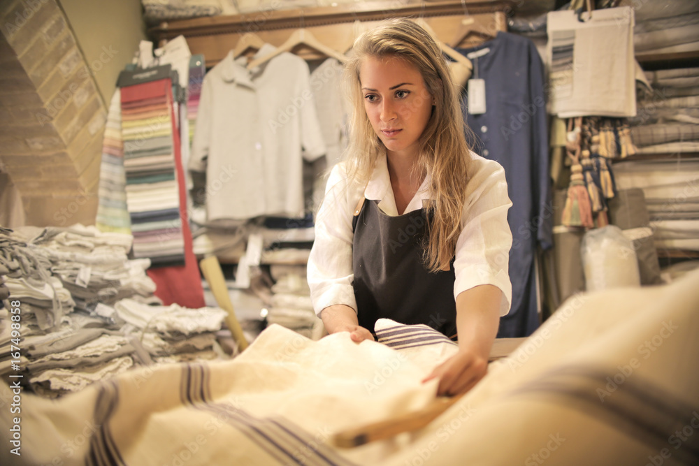 Tailor choosing a piece of fabric Tailor choosing a piece of fabric