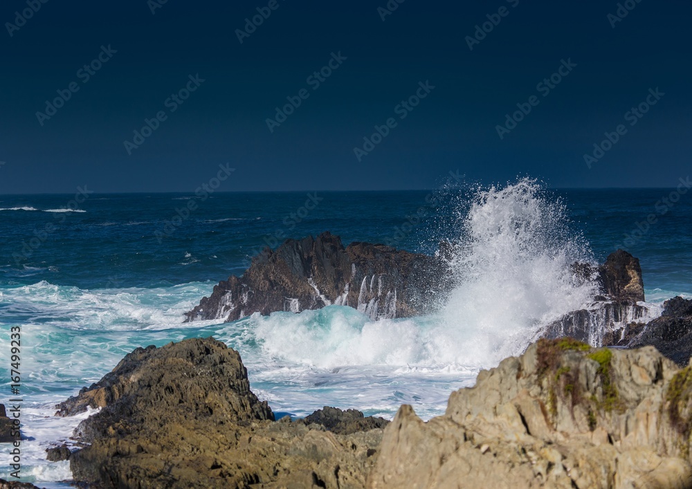 Breaking waves on the coast of the Otter Trail at the Indian Ocean Breaking waves on the coast of the Otter Trail at the Indian Ocean
