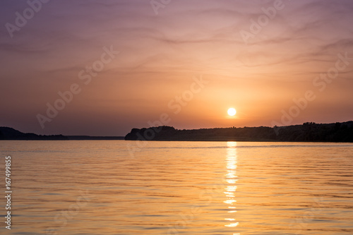 Beautiful abstract colorful sunset on the Danube river © zlajaphoto