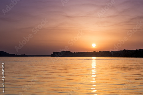 Beautiful abstract colorful sunset on the Danube river