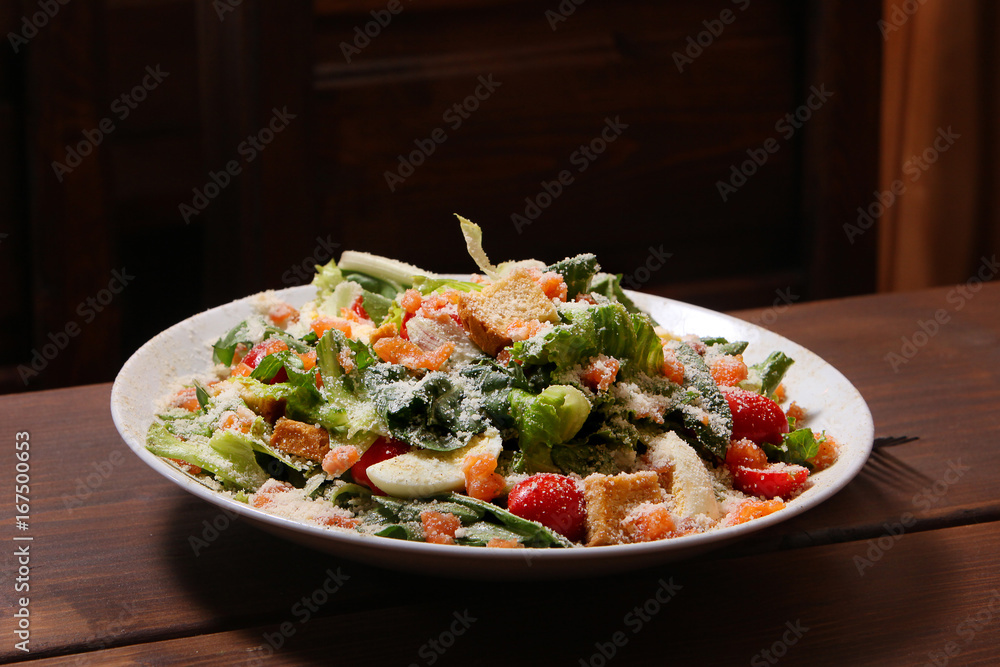 Green salad with salmon and Parmesan cheese Green salad with salmon and Parmesan cheese
