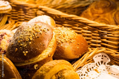 Buns with stuffing and pieces of nuts and sugar powder photo