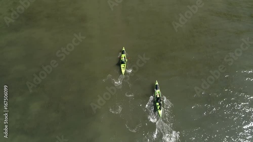 Overhead Aerial of 2 Kayakers and Dog Paddling Shallow Ocean Water