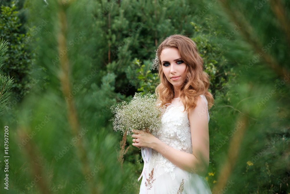 young pretty woman (bride) in white wedding dress outdoors, make up and hairstyle young pretty woman (bride) in white wedding dress outdoors, make up and hairstyle
