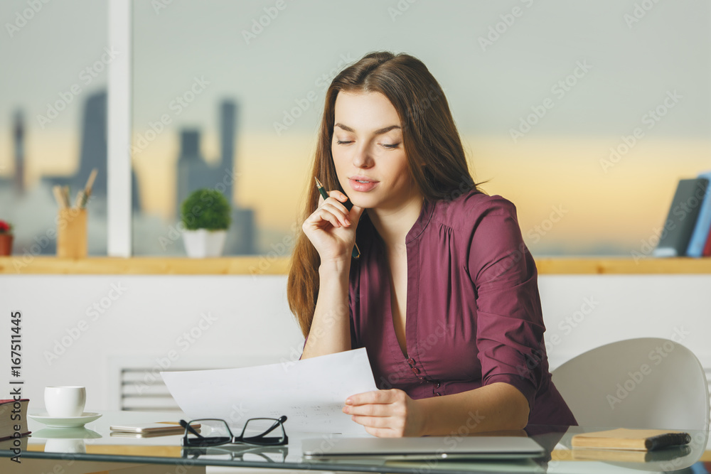 Attractive businesswoman working on project Attractive businesswoman working on project