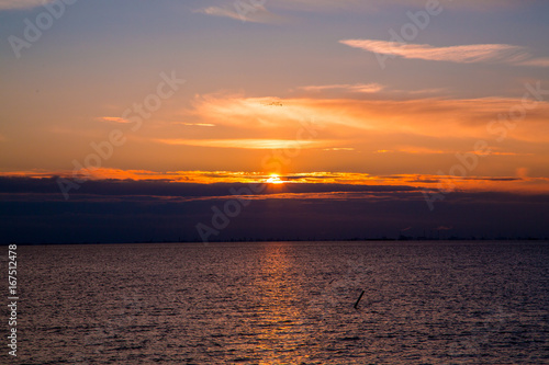 Oresunds bridge at sunset from the swedish side over to Denmark photo