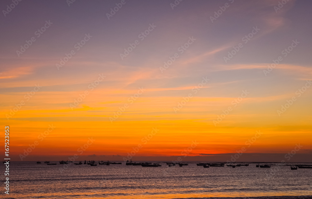 Colorful seascape sunset with fishing boats, Bali