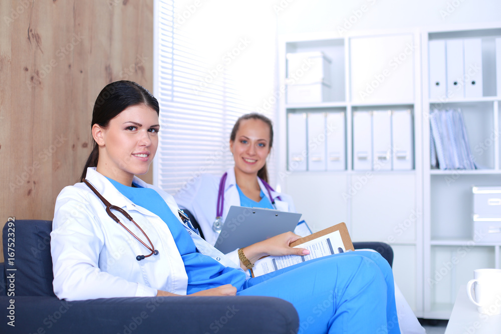 Happy medical team discussing and working together Happy medical team discussing and working together